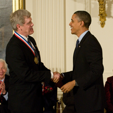 Steven Sasson shakes hands with President Barack Obama