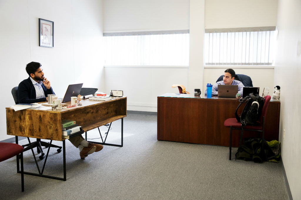 Ameer Shakeel (left) and Payam Pourtaheri work, literally, closely together to run the company they founded after teaming up for a research project during their final year in college.