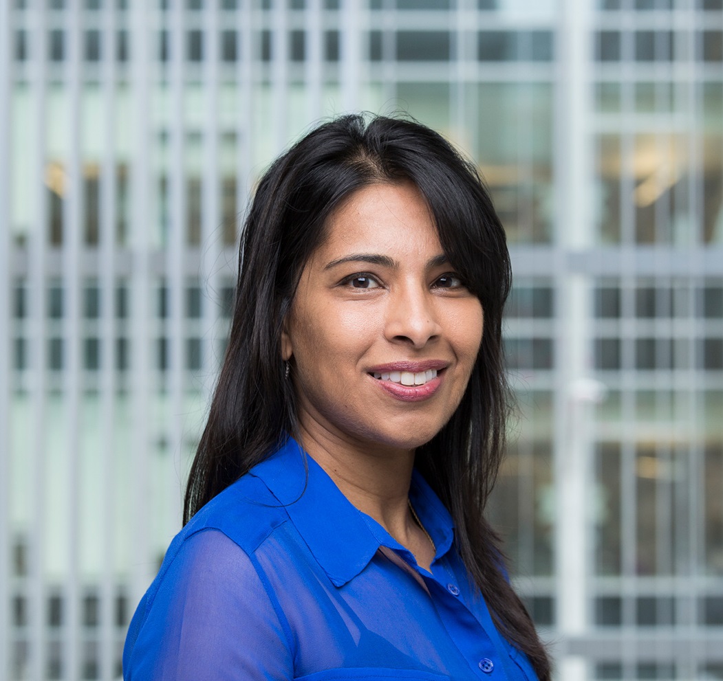 Sangeeta Bhatia smiles and turns toward the camera.