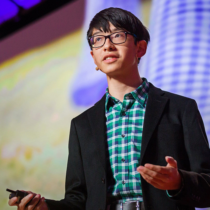 Kenneth Shinozuka presenting while looking at the audience off screen