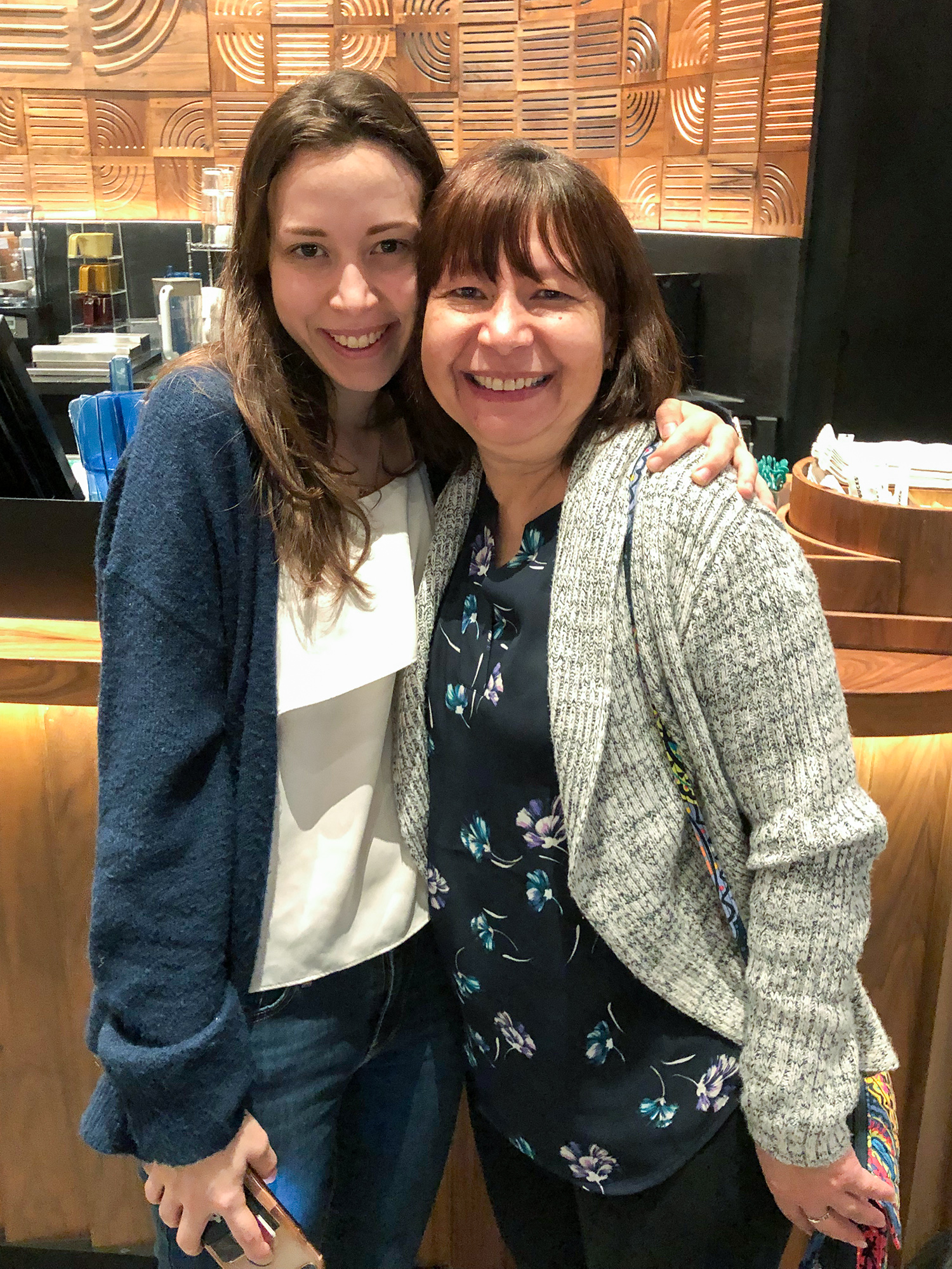 In a recent family snapshot, an adult Daniel Blanco bends down slightly to hug her mother around the shoulders while both grin broadly.