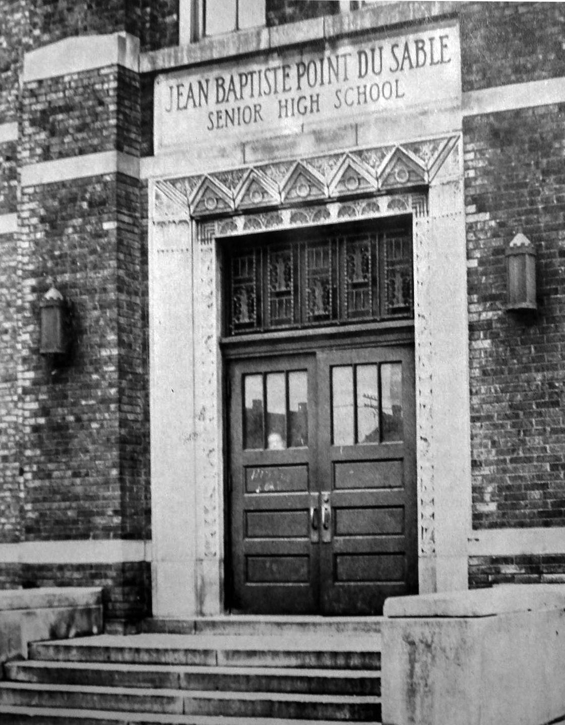 Black and white photograph of the entrance to DuSable High School in Chicago, Illinois. 