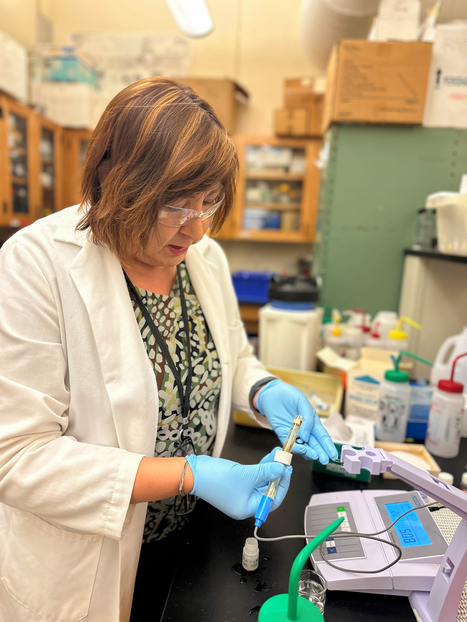 Chemist conducting pH test of water sample