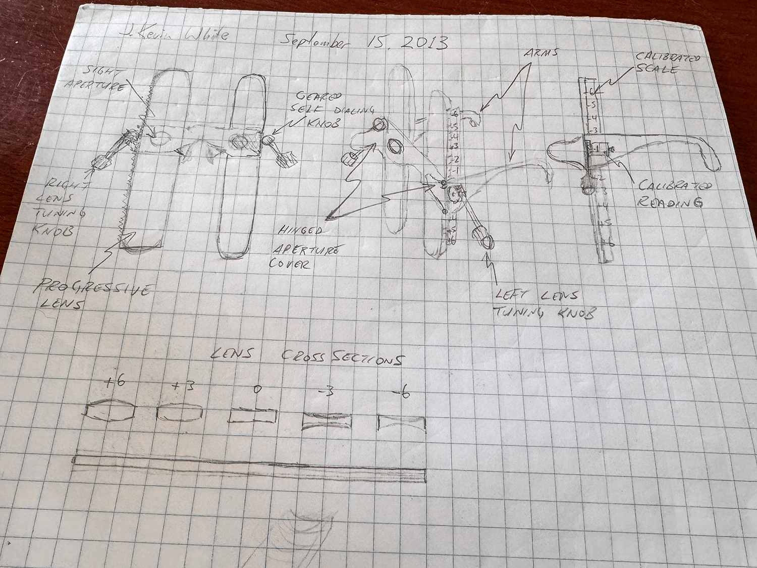 A pencil sketch of a vision diagnostic device on graphing paper.