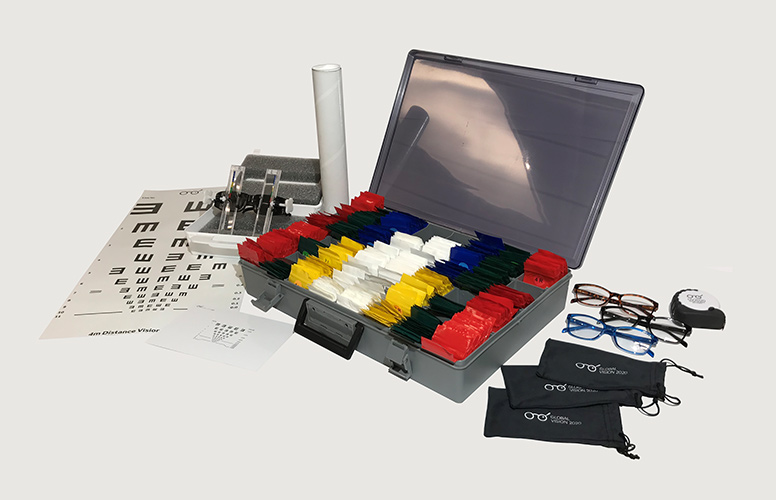 A rendering showing the components of the USee Vision Kit which includes color-coded lenses, eye chart, vision testing diagnostic tool, and several pairs of eyeglasses.