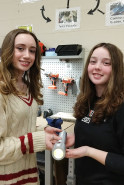 Lauren Strechay and Nicolette Buonora with their invention, the Battery Swap flashlight.