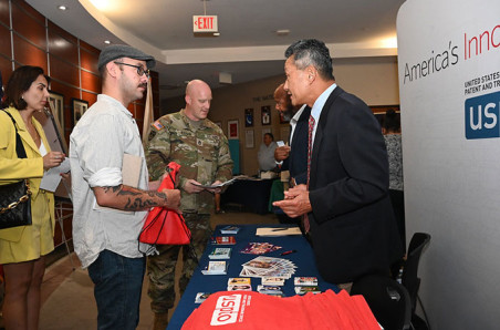 USPTO staff Alford Kindred and Harry Kim share entrepreneurship resources with military personnel and spouses at Hanscom Air Force Base