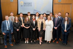 Acting Director Coke Stewart and Acting Commissioner for Patents Valencia Martin Wallace stand with regional-finalist team members in the National Patent Application Drafting Competition.