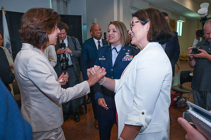 Secretary Raimondo greets Kim Howell, master of ceremonies for the Entrepreneurship Essentials Workshop and Resource Fair, and U.S. Coast Guard spouse