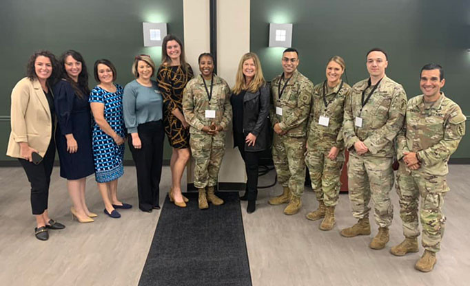 Director Vidal poses with service members and their families at Fort Bragg, NC