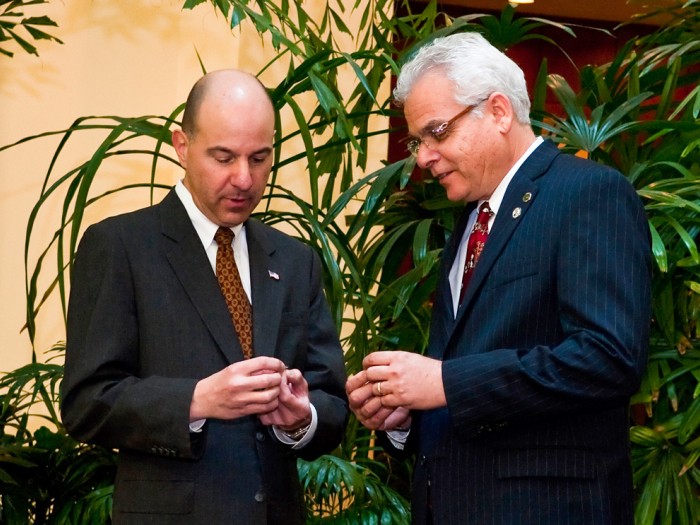 Paul Sanberg and David Kappos NAI pin exchange