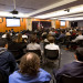 External stakeholders listen to remarks.