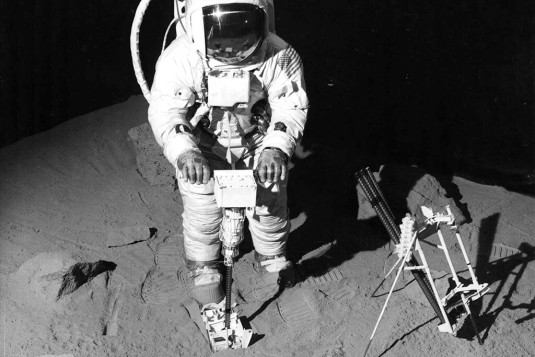 Image: The Black and Decker cordless Lunar Drill operated by an astronaut on a simulated surface of moon