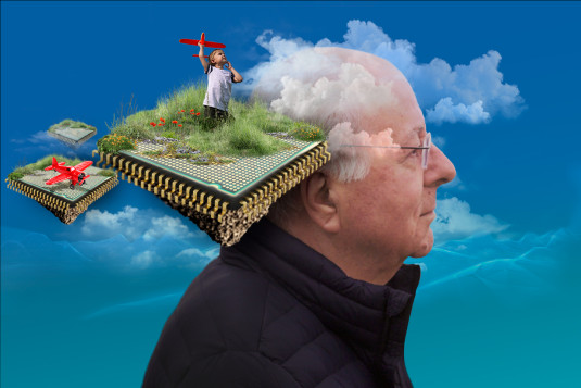 A photo of Federico Faggin is placed behind a floating microprocessor chip. Layered above the chip is a boy playing with a toy airplane.