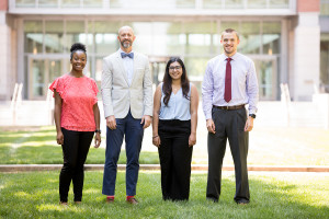 Portrait of externs Lauren Ingram, Trevor Ward, Neha Wasil, and Alex Phillips in front of USPTO headquarters