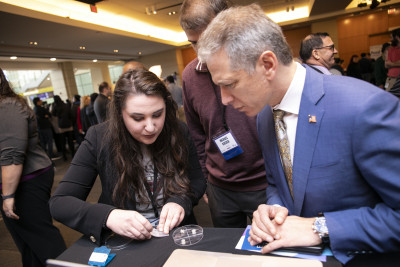 Director Iancu speaks to Finalists Nicole Black and Michael J. Kreder about their invention, PionEar.