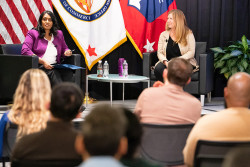 Commissioner for Patents Vaishali Udupa and Under Secretary Vidal sit on stage and speak to an audience