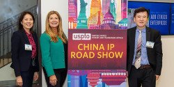 Director Vidal poses with two local entrepreneur and business owners at China IP roadshow event