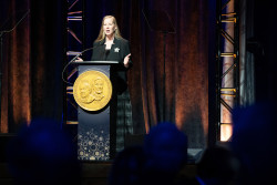 Acting Director of the USPTO Coke Stewart speaks at a podium.
