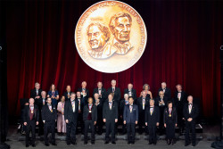 The 2025 National Inventors Hall of Fame inductees pose for a picture with their medals.