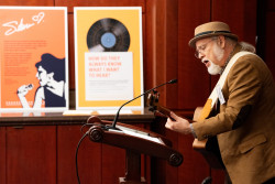 Man singing and playing guitar at the Celebration of World Intellectual Property Day 2025 at the US Capitol Building. The annual international event is an opportunity to learn about the role that intellectual property (IP) rights play in encouraging innovation and creativity. The theme of this year's celebration is "IP and Music: Feel the Beat of IP."