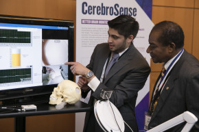 2017 Finalist Andrew Falcone explains his invention to NIHF Inductee Victor Lawrence during the Expo