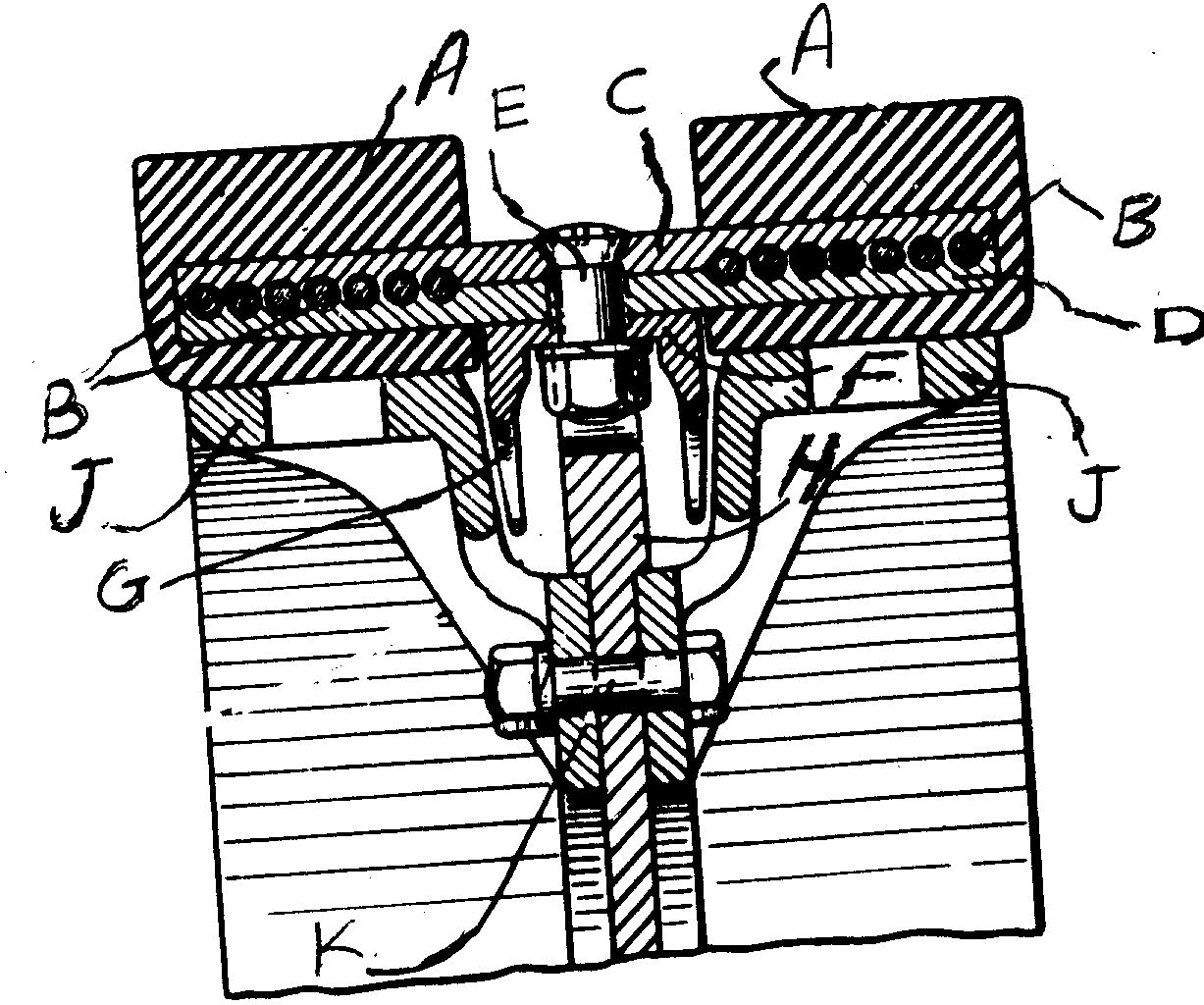 A - Endless band; B - Wire cable reinforcement; C, D - Overlappingcore bars; E - Bolts for bar; F - Removable wear member; G - Integralguide plate; H - Sprocket wheel; J - Guide pulleys; K - Bolts forholding sprocket & pulley together
